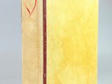 an old book with a heart drawn on the cover