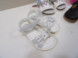 several pairs of baby shoes are lined up on a table