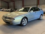 a picture of a silver car parked in a garage