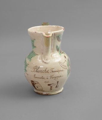 a white vase with a map on it sitting on a table