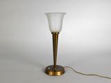 a close up of a lamp on a table with a white background