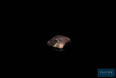 an image of a piece of rock in the dark