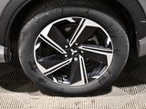 a close up view of a car ' s wheel on the ground