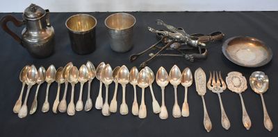 a lot of silver spoons and silverware on a table