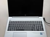 an open laptop computer sitting on top of a desk next to a mouse