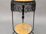 a black and gold table with a marble top on a stand