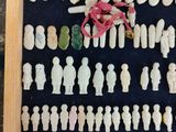 a shadow box with a lot of small figurines in it