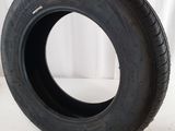 a close up of a tire on a white surface with a white background