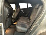 the back seats of a car with a seat belt in it