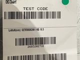 a close up of a barcode with a green dot on it