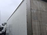 a white truck that is parked in front of a building
