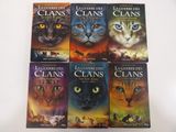 six books in a row with a cat ' s face on them
