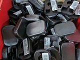 a cardboard box full of assorted black and red items