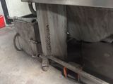 an image of a machine that is sitting in a garage