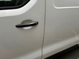 a close up of a door handle on a white car