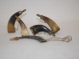 three horn horn shaped objects are on a white surface