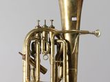 a brass instrument that is sitting on a table