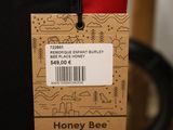 a label on the back of a bag that says honey bee