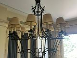 a chandelier that is hanging from the ceiling in a dining room