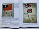 an open book with a picture of a flag and a pair of scissors on it