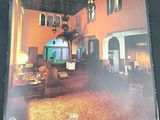 an image of a picture of a living room with a clock on the wall
