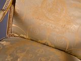 a chair that has a gold upholstered upholstered upholstered upholstered upholstered upholstered upholstered upholstered