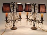 three lamps that are on a table with a lamp on it