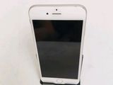a white cell phone sitting on top of a white table
