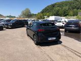 many cars parked in a parking lot in a lot