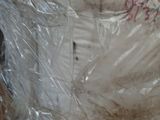 a toilet that is wrapped in plastic and sitting on the floor