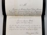 an old document with writing on it sitting on a table