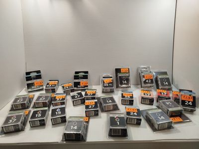 a lot of cassettes on a table in a room