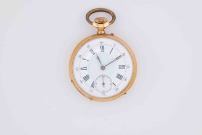 a gold pocket watch with roman numerals on the face