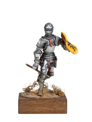 statue of a knight with a sword and shield on a wooden base