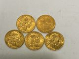 five gold sovereigns, one of which is a sovereign and the other of which is a sovereign