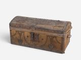 an old wooden trunk with a metal latch on it