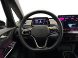 the interior of a car with a steering wheel and a touch screen
