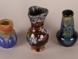 three vases sitting next to each other on a table