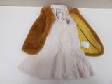 a white dress and a brown jacket on a white table