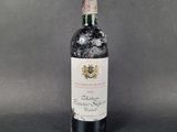 a bottle of wine that is sitting on a table