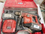 a red tool box with tools in it on a table