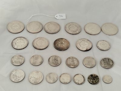 a close up of a bunch of coins on a white surface