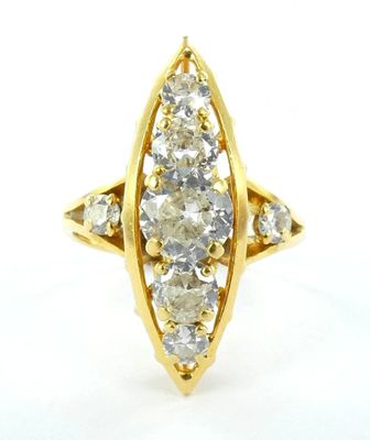 a close up of a gold ring with diamonds on a white background