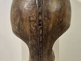 a vase that is sitting on a pedestal in a room
