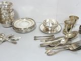 a table with silverware on it and silverware on the table