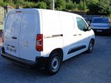 a white van that is parked in a parking lot