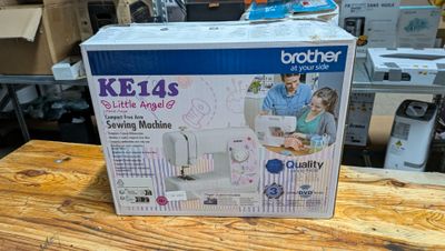 a box that is sitting on a table with a sewing machine