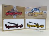 three boxes with different types of construction vehicles on them
