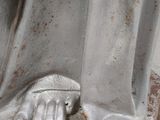 a statue of a man holding a baby in his lap