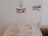 two glasses sitting on top of a box on a table